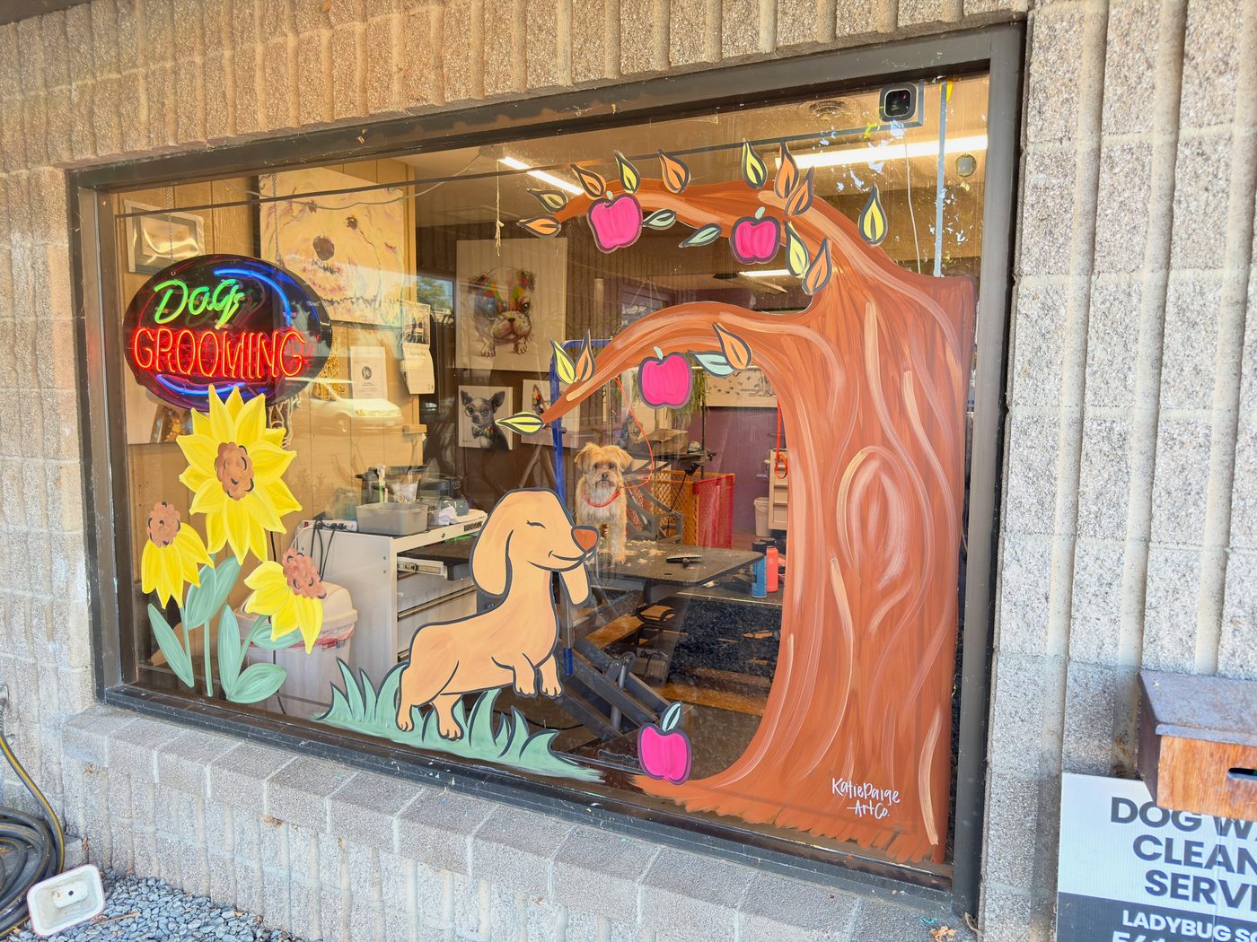 Fall window with a dachshund, sunflowers, and an apple tree at Just Great Grooming by Katie Paige Art Co