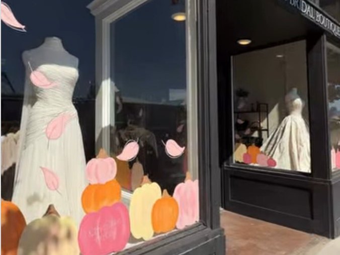 Fall pumpkin and leaf window painting at Pearl & Penna Bridal Boutique by Katie Paige Art Co